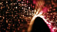 Undulating mesh formed with red bokeh lights 