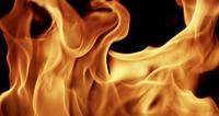 Close-up-to-dynamic-flames-creating-a-firewall-on-dark-background-in-4k-slow-motion