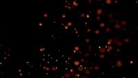 Several-groups-of-fire-embers-flying-on-darkness-in-4k