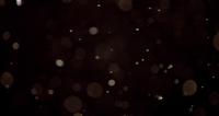 Bright-particles-with-bokeh-effect-falling-like-snow-on-dark-background-in-4k