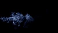 Awesome-smoke-effect-moving-slow-and-drawing-spirals-on-dark-background-in-4k