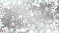 Beautiful-snowflakes-rotating-on-a-grey-background-lens-flare-bokeh