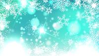 Beautiful-snowflakes-rotating-on-a-blue-background-lens-flare-bokeh