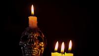Skull_with_candles_in_dark_atmosphere_1590