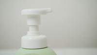 Close up Hands Pumping Cream