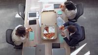 Employees Have Lunch at Work