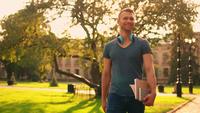 Young Man Walking Outdoors in Slow Motion