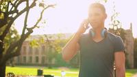 Happy Guy Speaking on The Phone in The Street