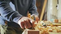 Carpenter Planks a Wooden Board