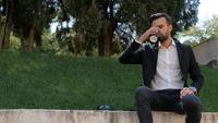 Man in A Park Drinking Coffee