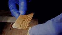 Man Paints Wood Comb